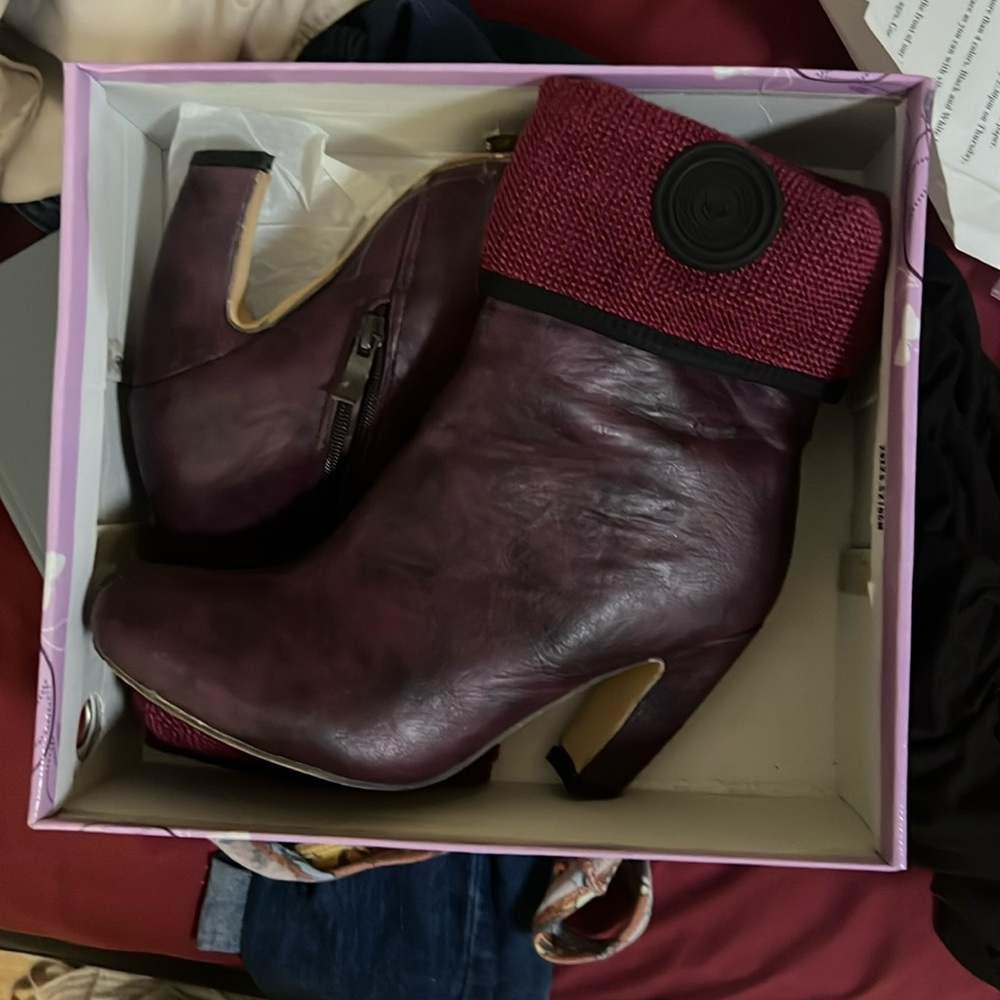 Pair of burgundy ankle boot with a small heal size 7